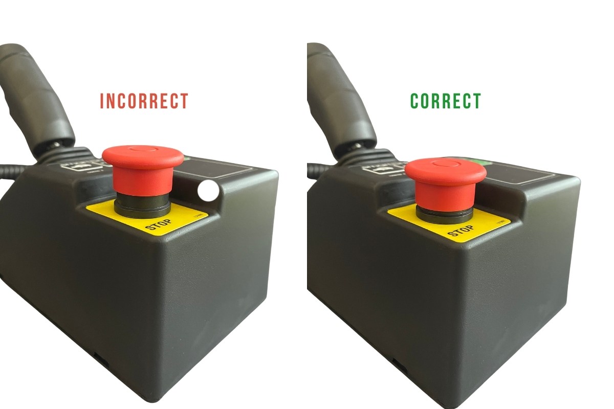 Step 1 - turning of the scissor lift Scissor lift control console zoomed on the e-stop button